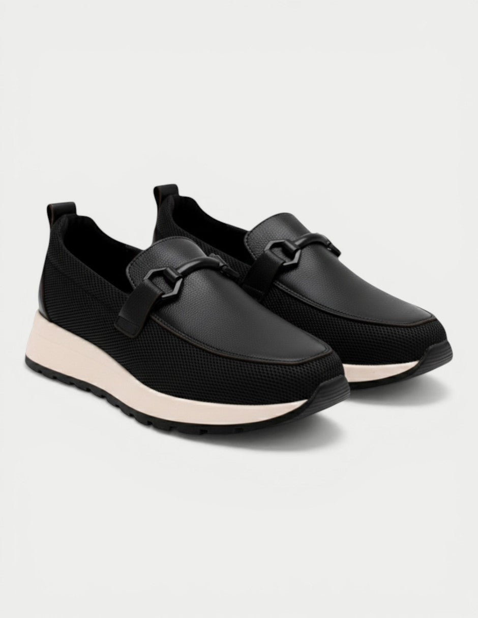 Manet black leather and mesh slip-on loafers with decorative buckle and light sole.