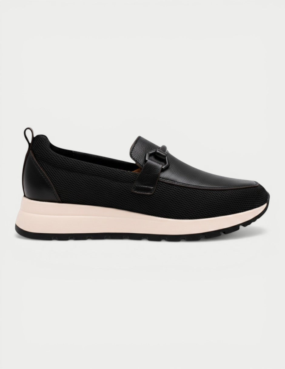 Manet black leather and mesh slip-on loafers with a decorative buckle and a light pink sole.