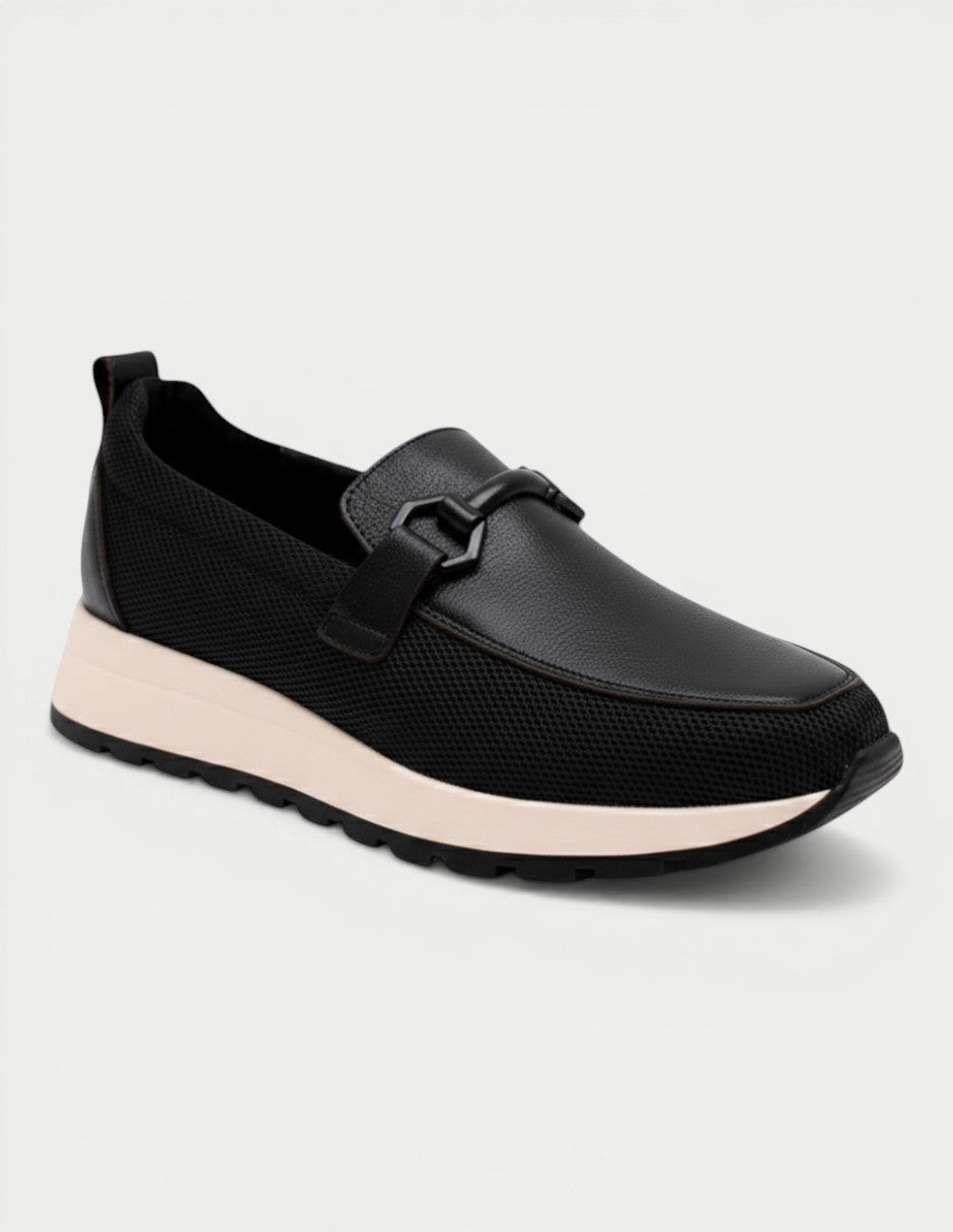 Manet black leather and mesh slip-on loafers with decorative buckle and light pink sole.