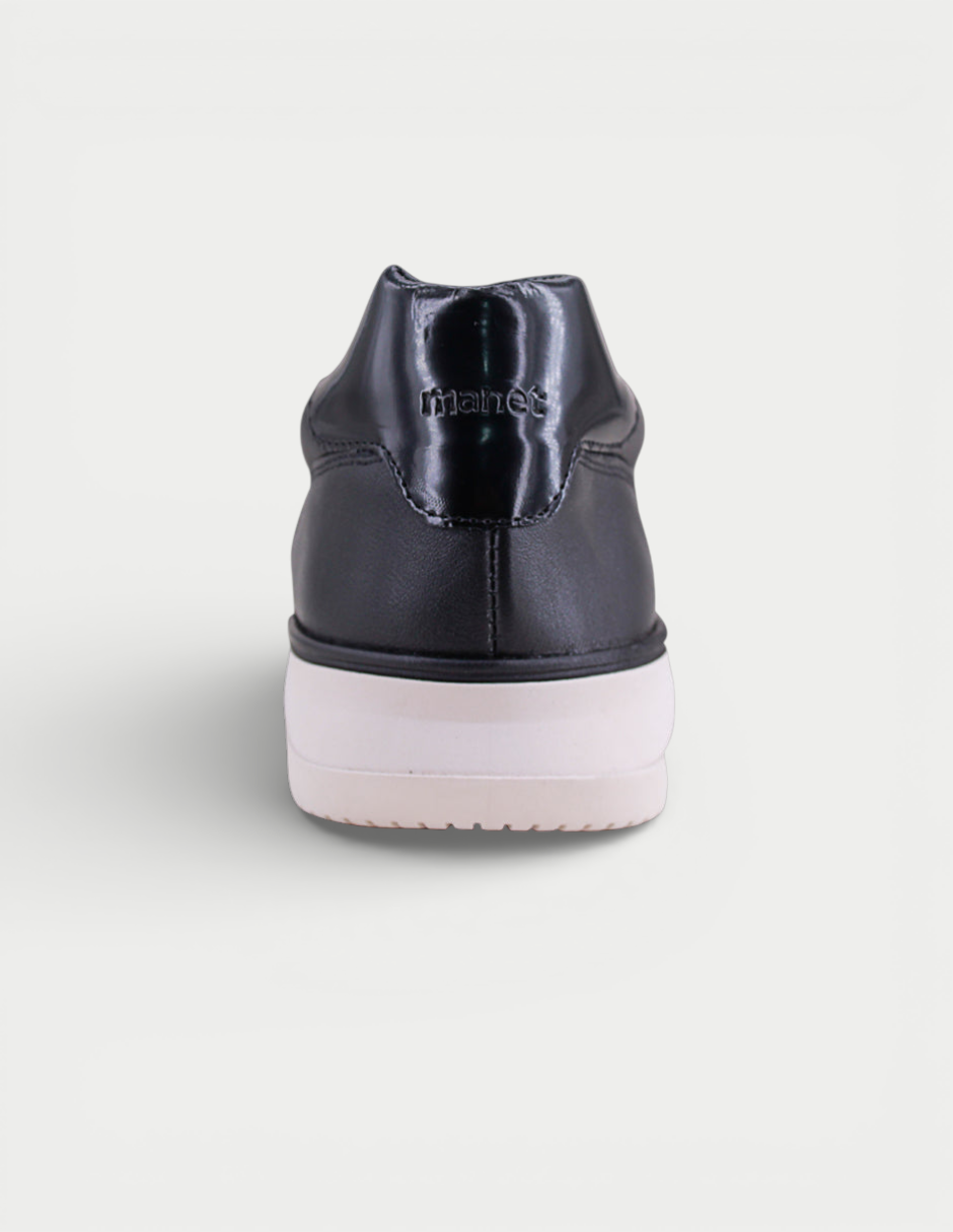 Manet Midas 01 black leather sneakers with white sole and shiny heel detail.