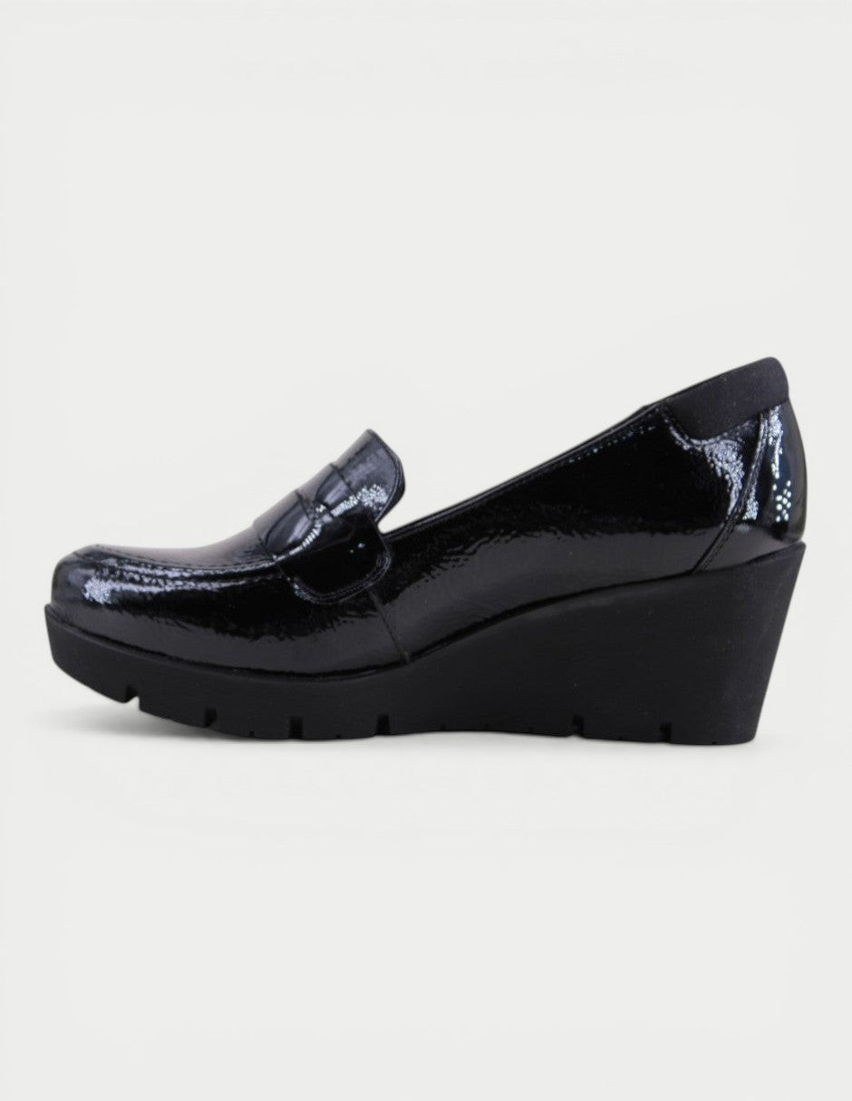 Manet black patent leather wedge loafers with crocodile embossed detail and comfortable sole.