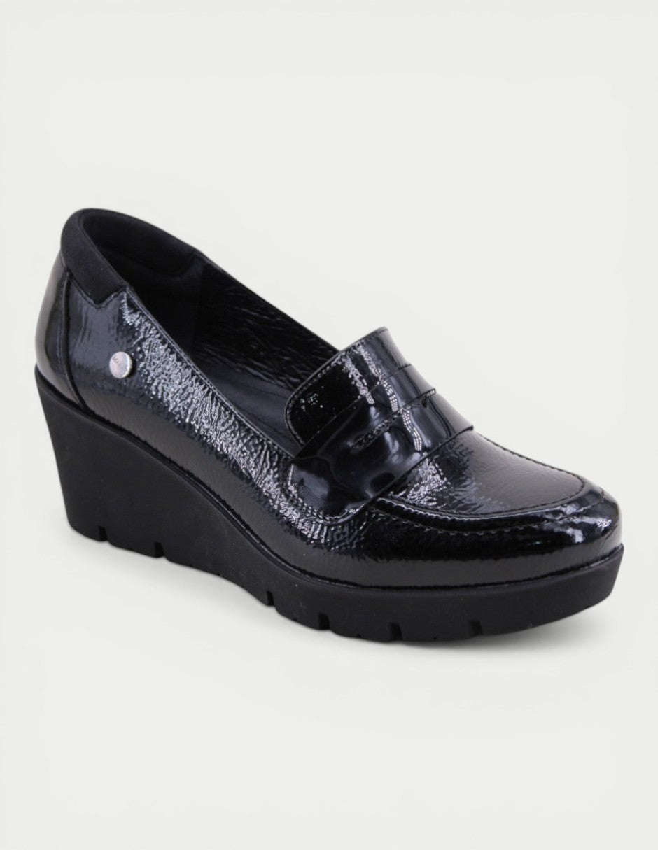 Manet black patent leather wedge loafers with a comfortable fit and sophisticated style.