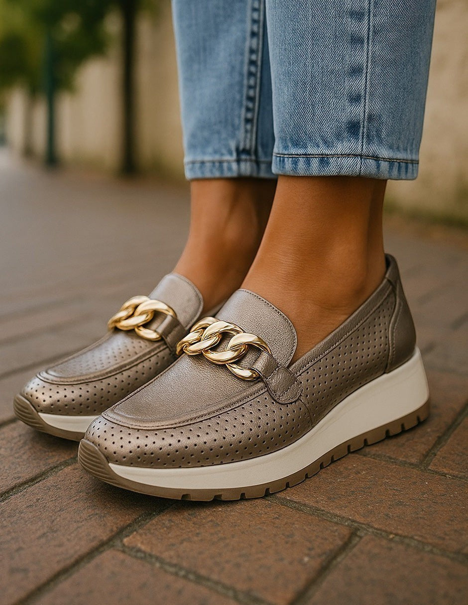 Manet bronze perforated leather loafers with gold chain detail and elevated sole. Comfortable and stylish.